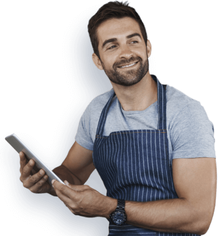 Employer smiling while reviewing group health insurance plan on a tablet