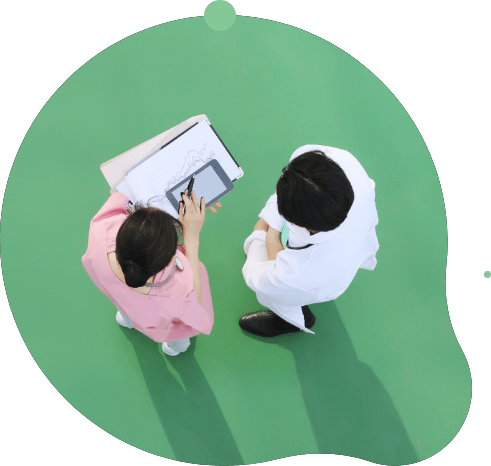 Two providers looking over paperwork